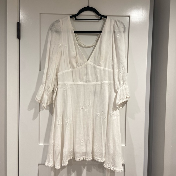 Embroidered white v neck sundress with open back and back bow tie detail - Picture 4 of 10